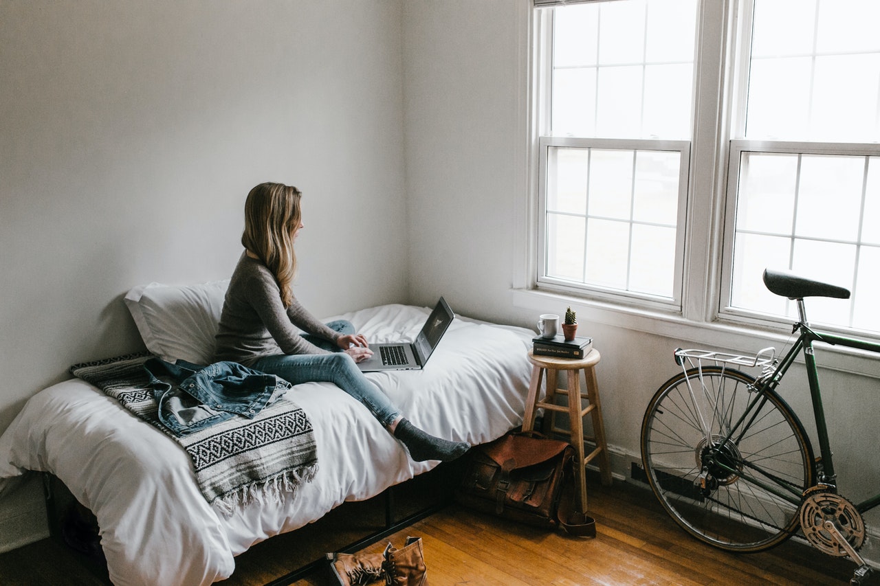 woman working in her bedroom