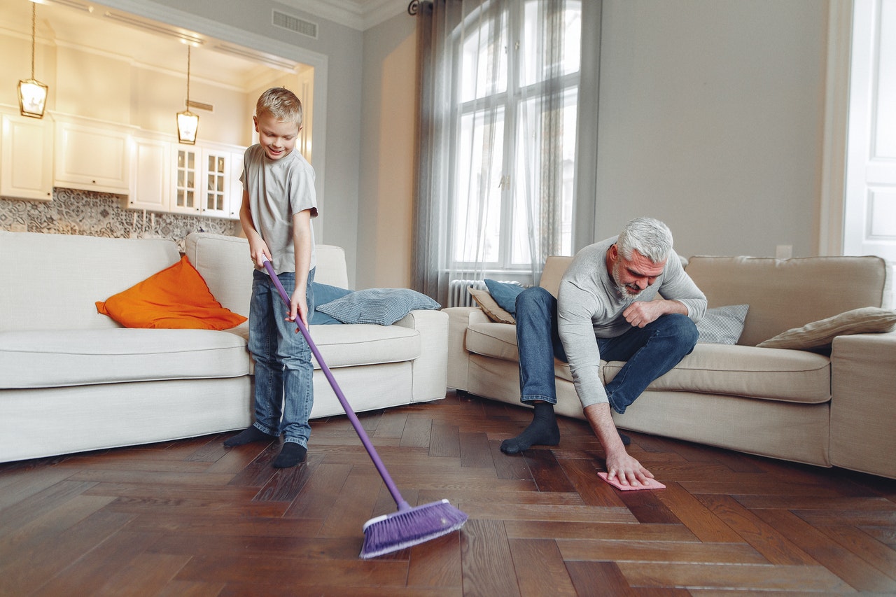 father and son cleaning their home