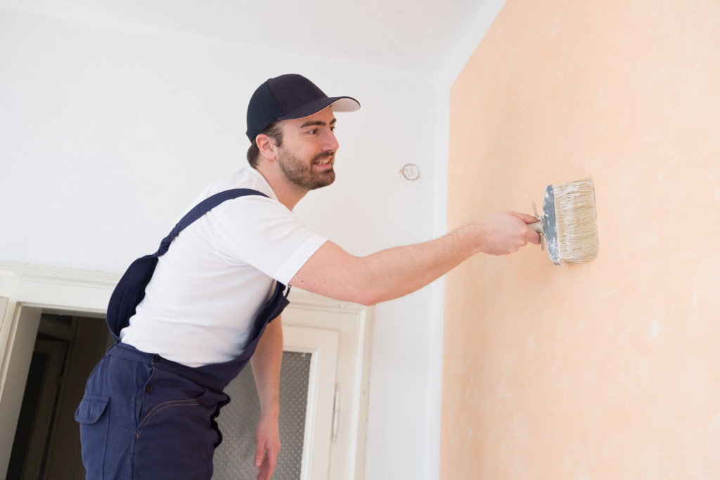 man painting a room