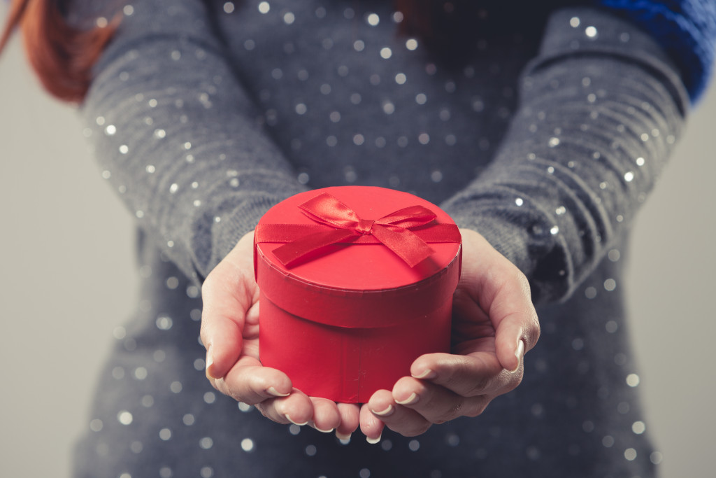 woman holding a gift box