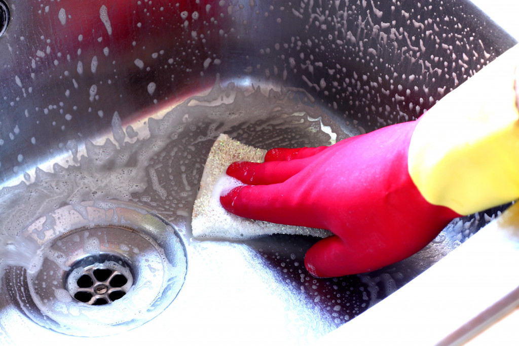 kitchen sink being cleaned