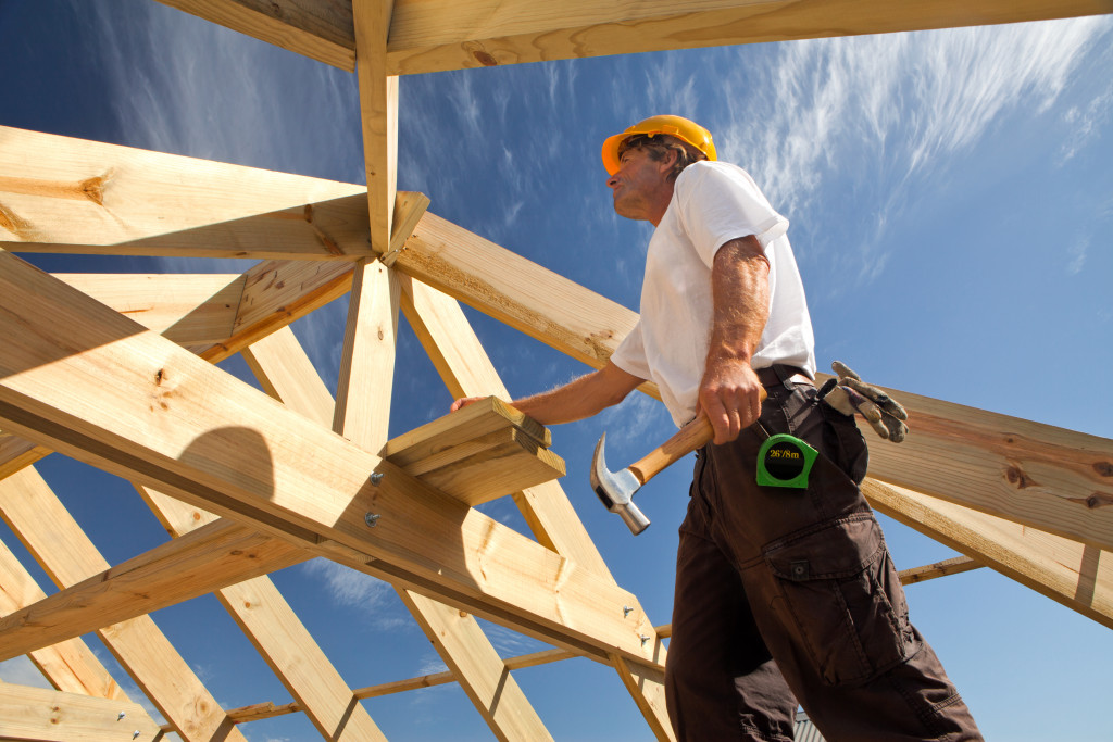 man building a roof