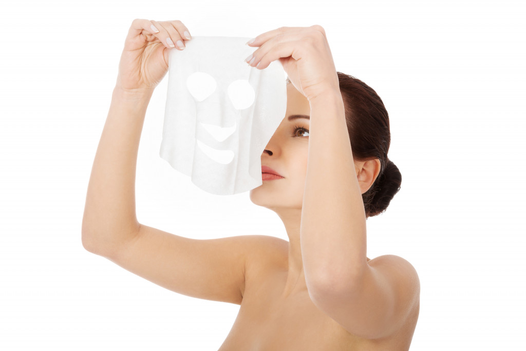 woman with collagen mask on face.