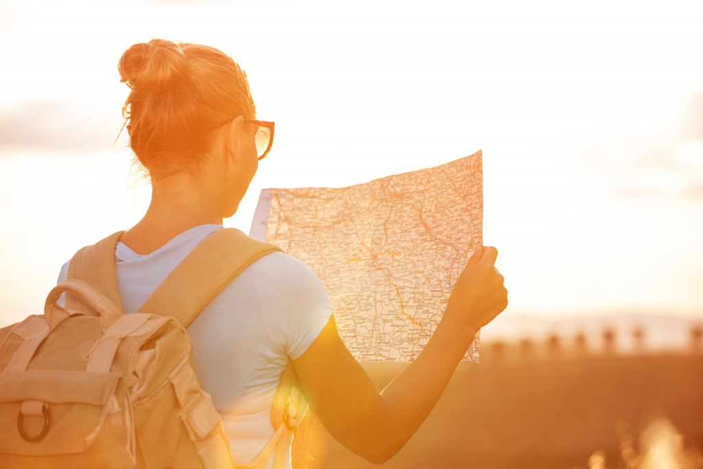 Traveler looks at map