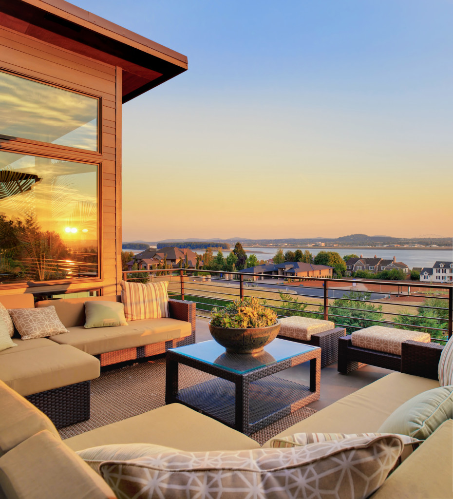 beautiful home patio with a sunset view