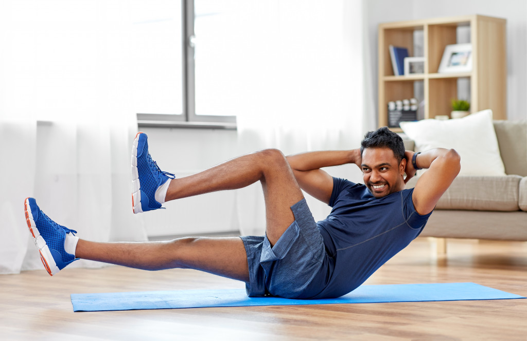 smiling man working out at home