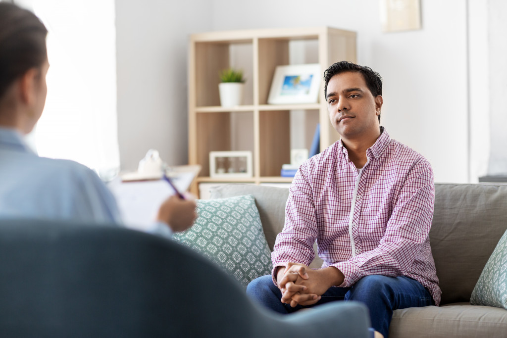 man talking to his therapist in the clinic