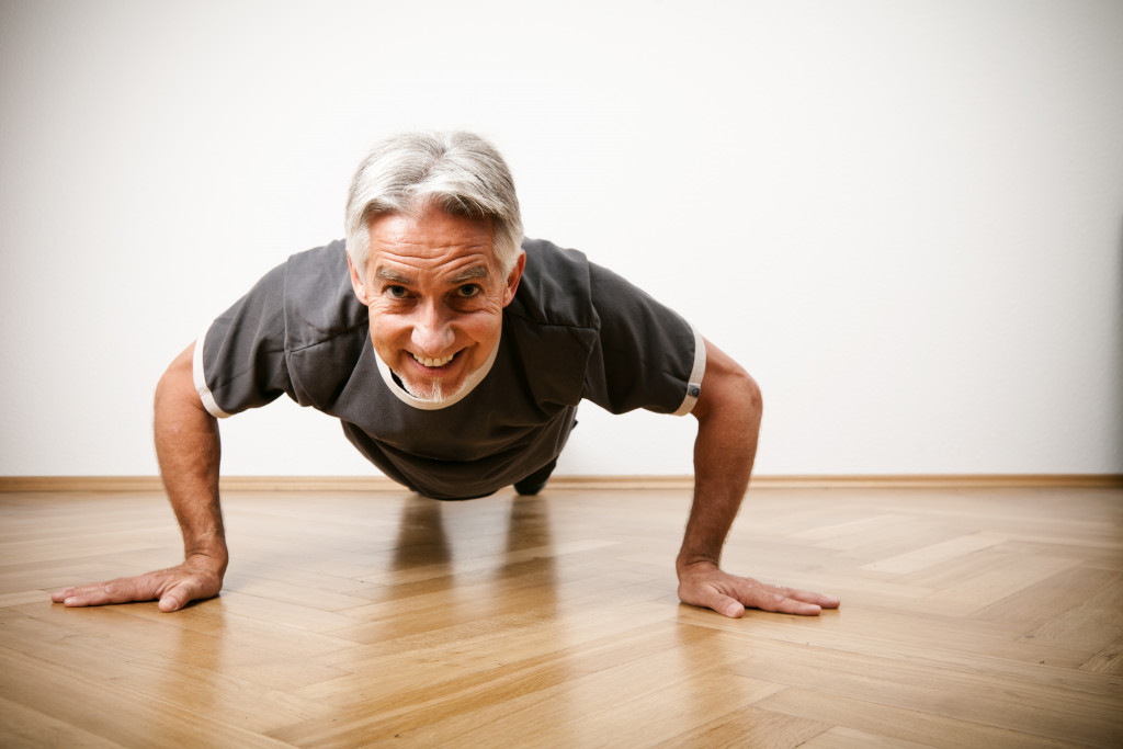 A senior man doing planks