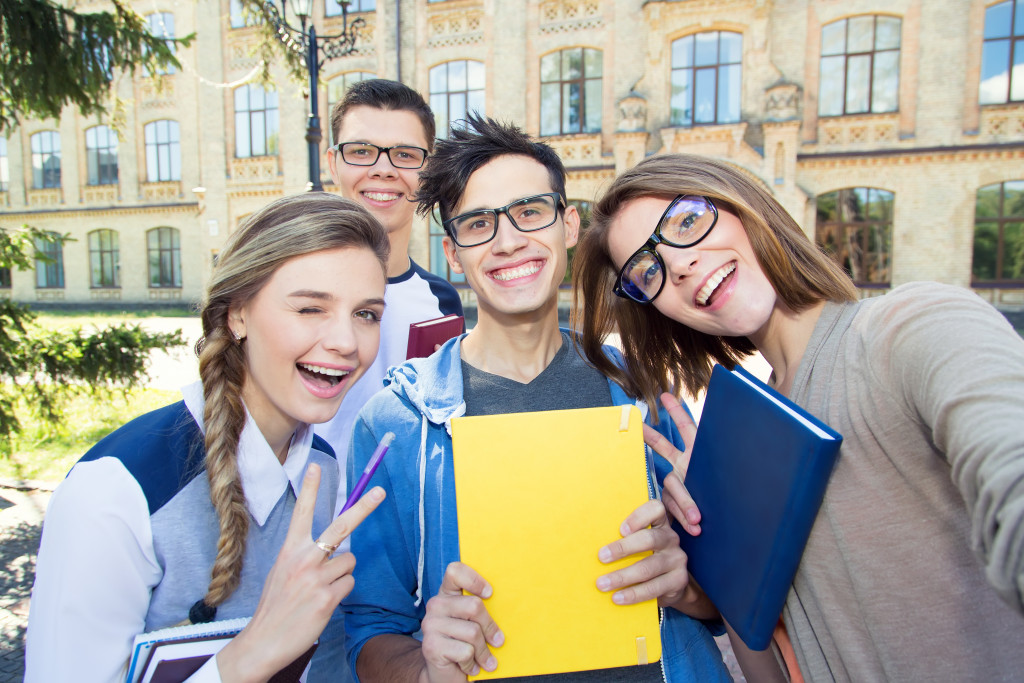 Young women hanging out with friends at school.